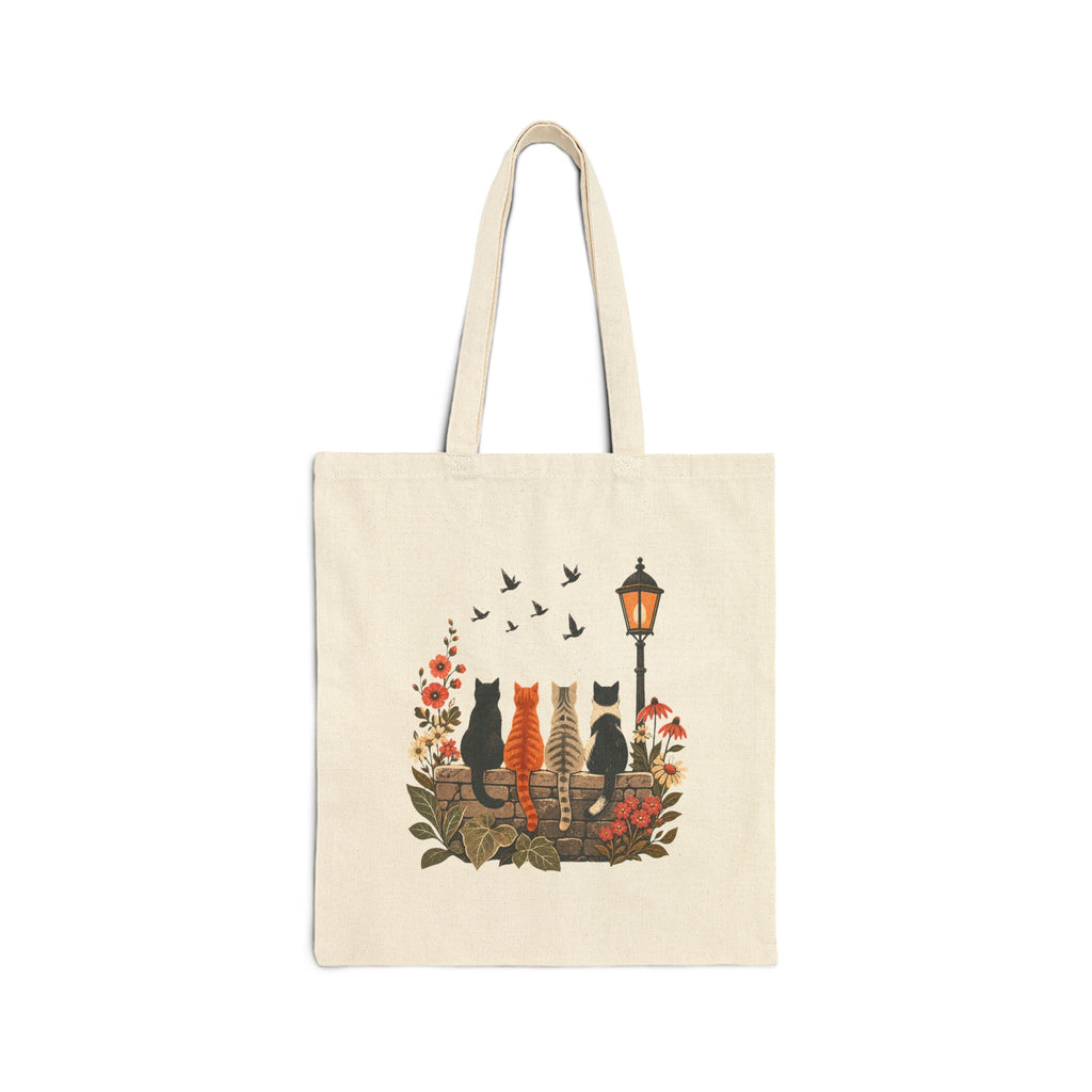 Side A of natural canvas tote showing four cats from behind watching birds