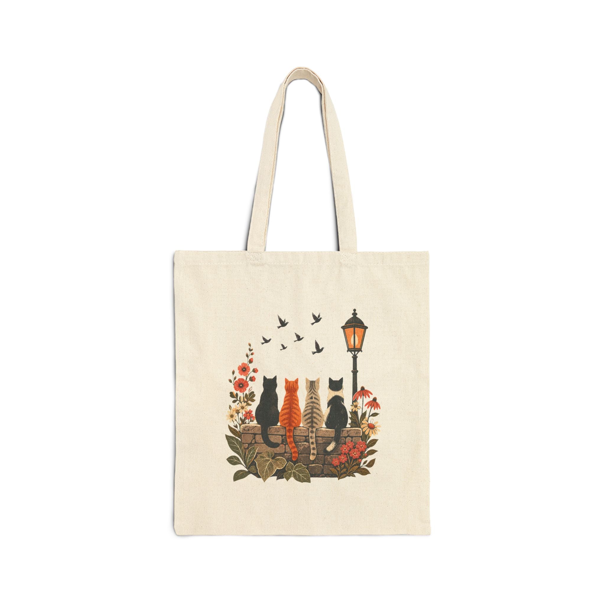 Side A of natural canvas tote showing four cats from behind watching birds