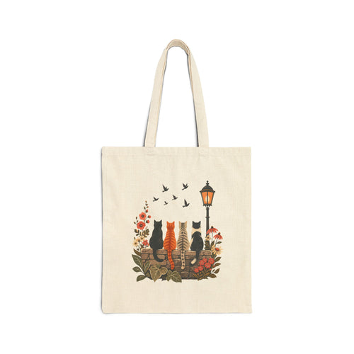 Side A of natural canvas tote showing four cats from behind watching birds